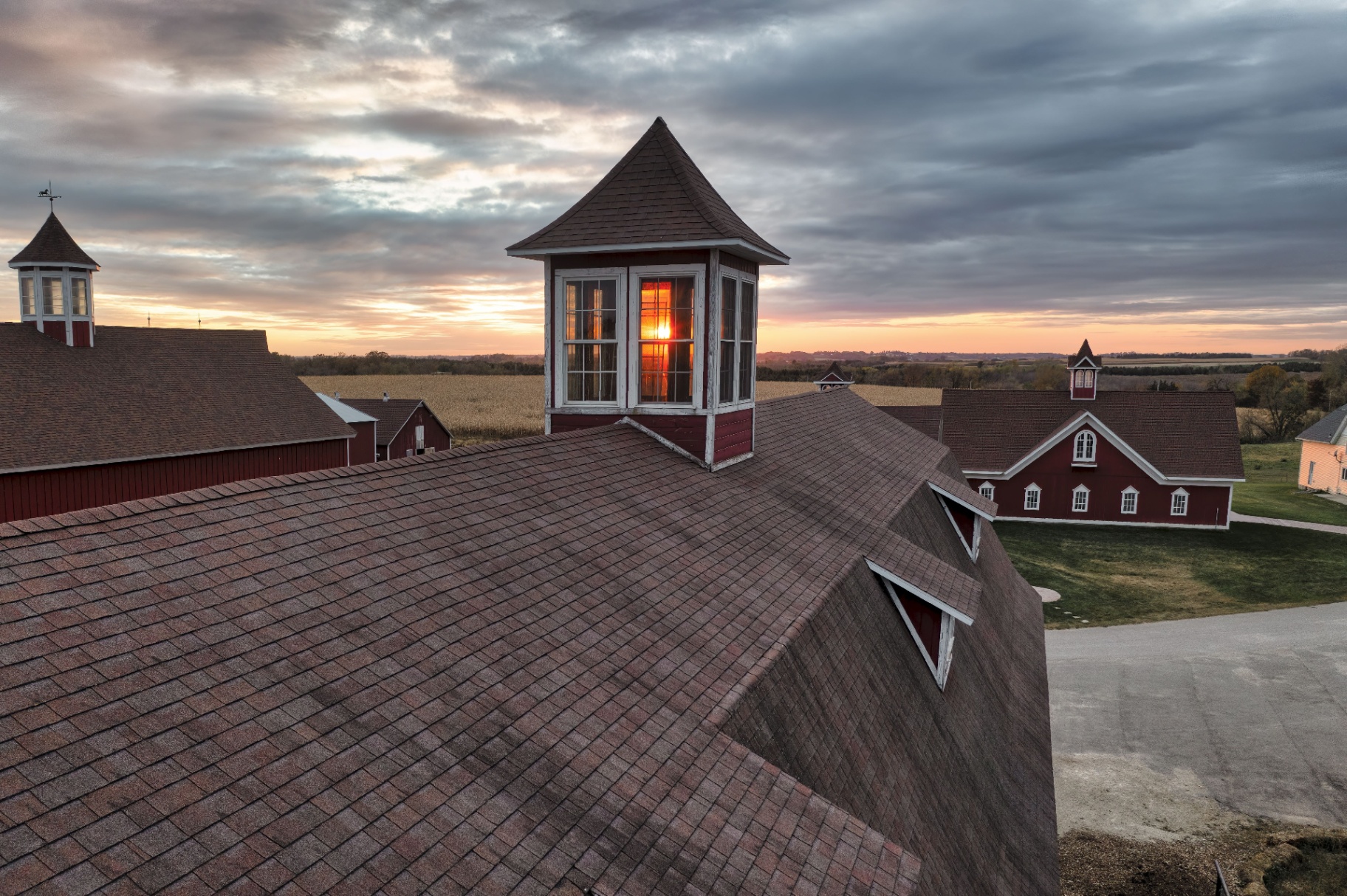 Residential home with a freshly completed roof at sunset